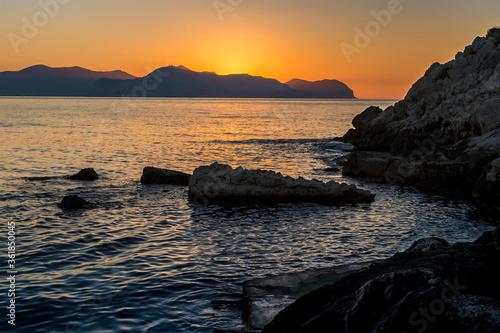 Sunset in the Gulf of Palermo viewed from a secluded beach near Bagheria on a summer's evening