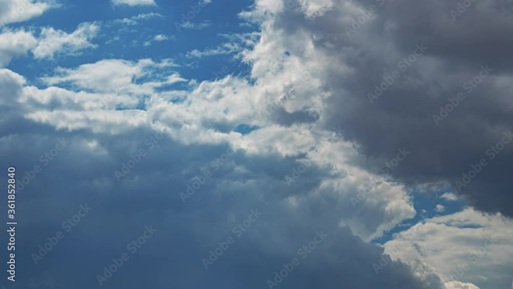 Large, fluffy clouds forming and disbursing in this dramatic time lapse cloudscape Large, fluffy clouds forming and disbursing in this dramatic time lapse cloudscape