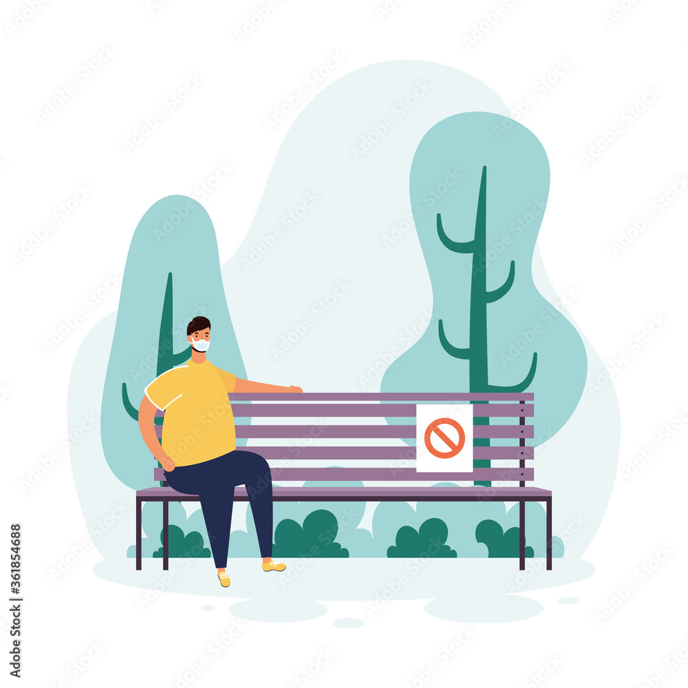 man wearign medical mask seated in park chair scene man wearign medical mask seated in park chair scene