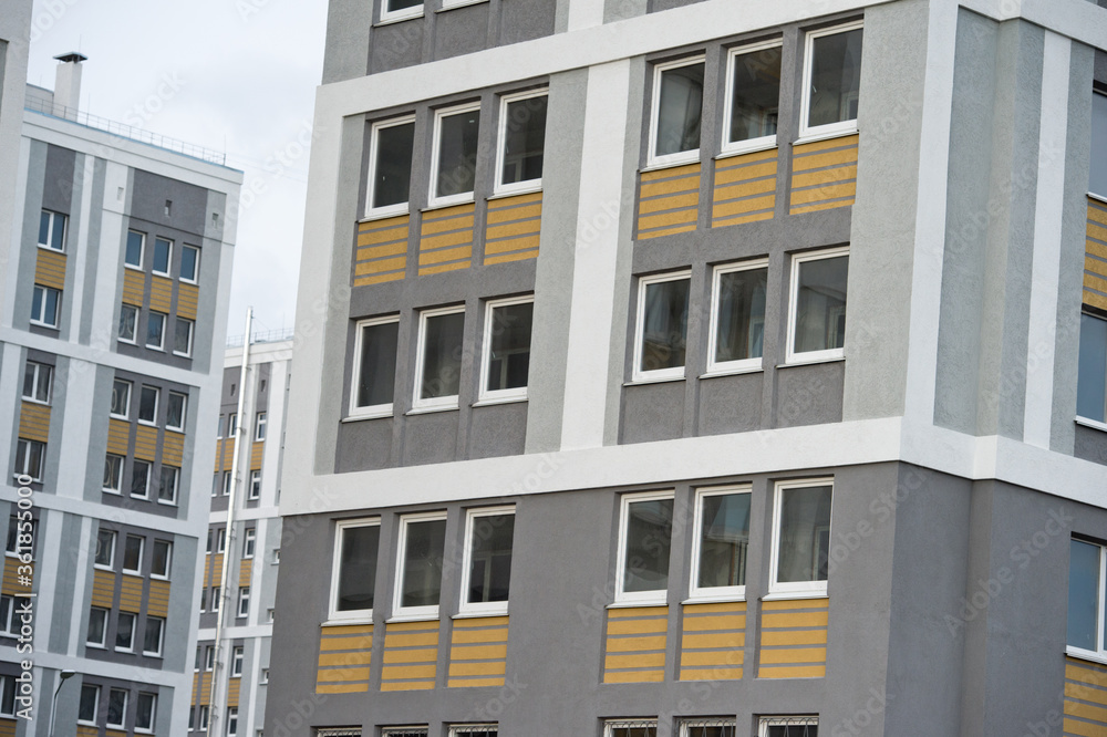 Apartment in the mortgage. Apartment buildings. Facade of a modern apartment building Apartment in the mortgage. Apartment buildings. Facade of a modern apartment building