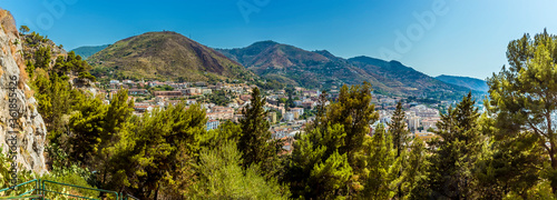 A panorama view above the tree line from the mesa behind the town of Cefalu, Sicily in summer