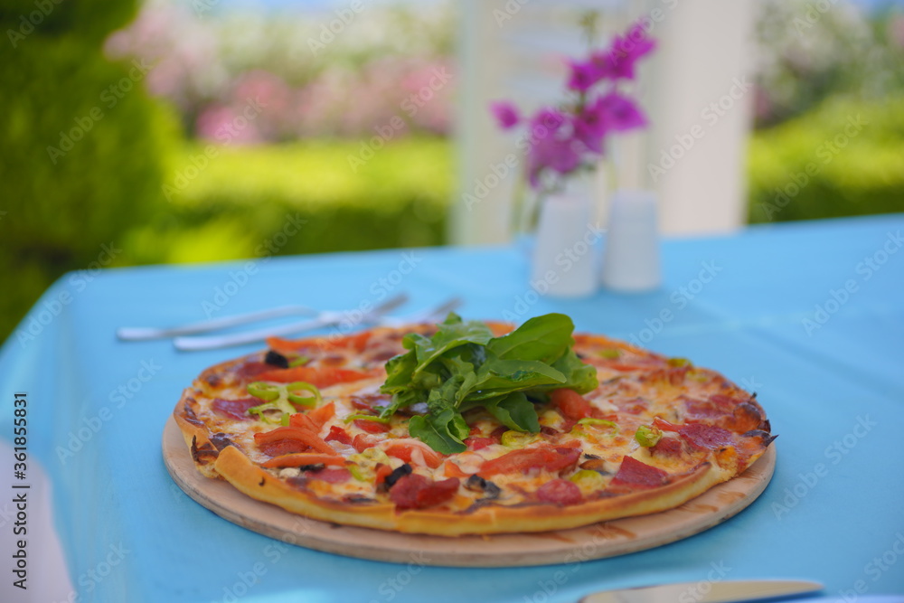delicious pizza with basil and cheese on it delicious pizza with basil and cheese on it