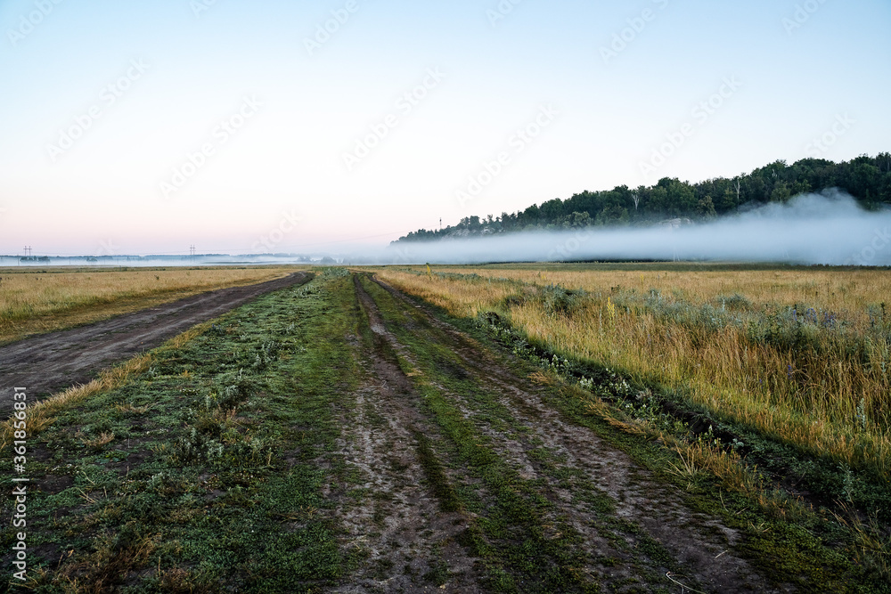 mountain view of fog in the early morning, nature of Russia, fog below, travel in nature, summer landscape, forest and mountains