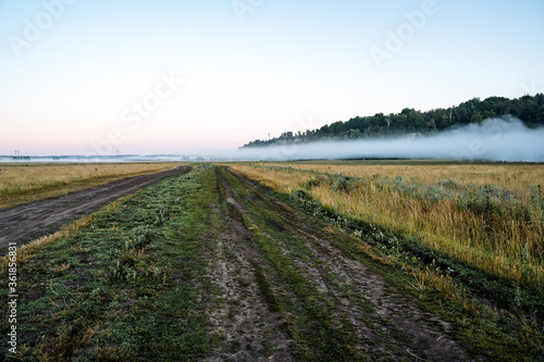 mountain view of fog in the early morning, nature of Russia, fog below, travel in nature, summer landscape, forest and mountains