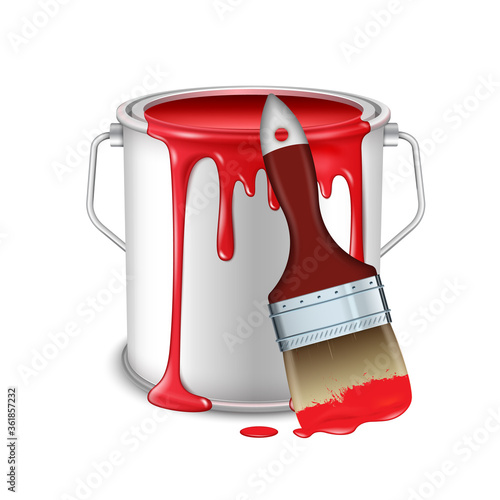 An open tin can with spilled red paint and a brush smeared in paint.