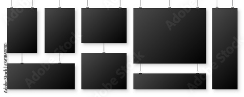 Realistic blank paper sheets hanging on binder clip. Black vector poster with shadow in A4 format. Design template, mockup.