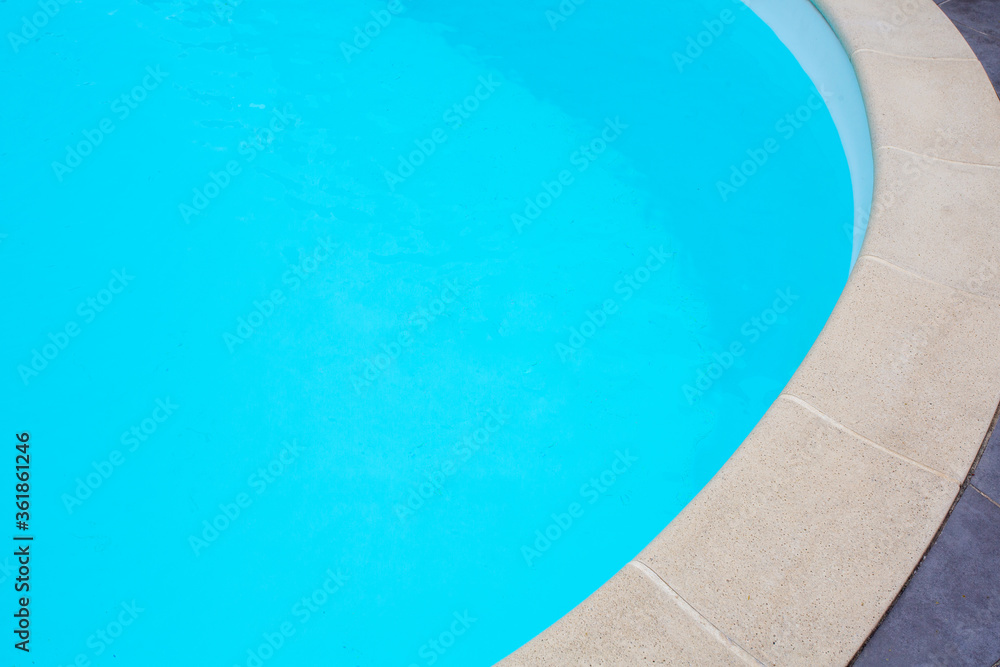 part curve of swimming pool detail with blue water