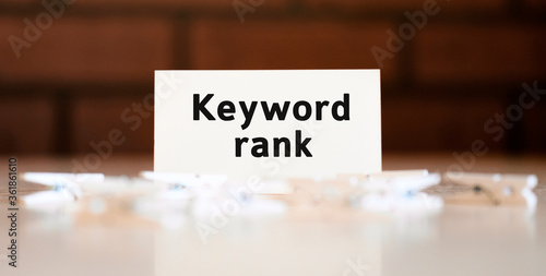 Keywords rank - text of business concept on white list and with clothespins photo