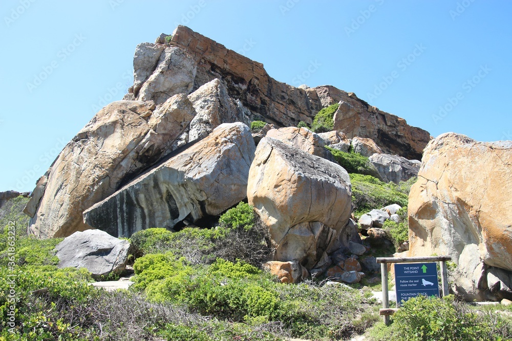 OOn Robberg Peninsula near Plettenberg Bay, South Africa. Trail map for visitors and landscape. In Robberg Nature Reserve, a world heritage site. Garden Route, Africa.