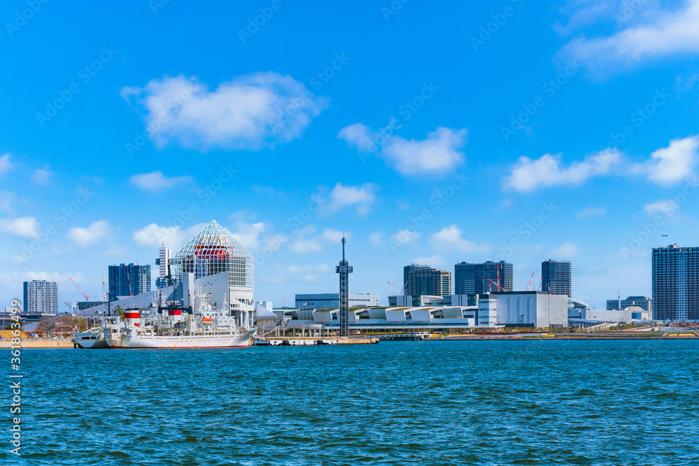 Seascape of ship moored at Harumi Passenger Terminal and Harumi Wharf on Tokyo Bay in front of the new Toyosu Wholesale Fish Market and Toyosu Gururi Park BBQ place. Seascape of ship moored at Harumi Passenger Terminal and Harumi Wharf on Tokyo Bay in front of the new Toyosu Wholesale Fish Market and Toyosu Gururi Park BBQ place.