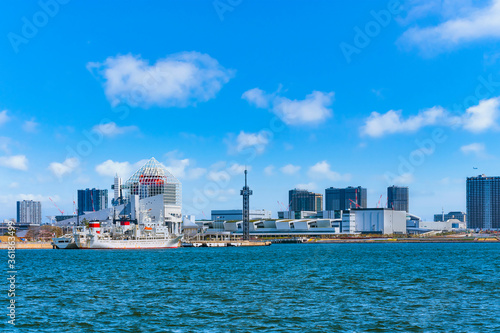 Seascape of ship moored at Harumi Passenger Terminal and Harumi Wharf on Tokyo Bay in front of the new Toyosu Wholesale Fish Market and Toyosu Gururi Park BBQ place.
