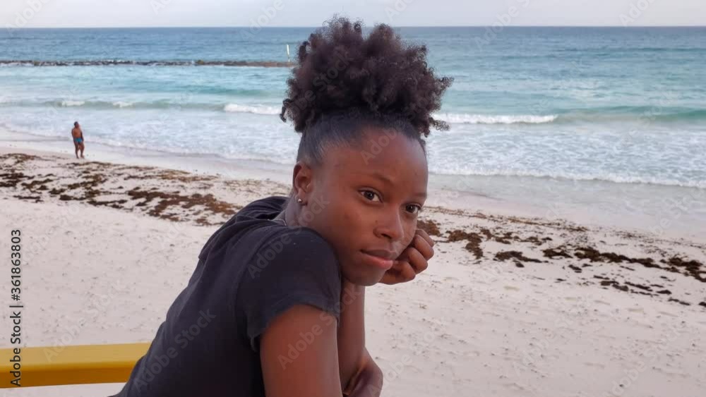 Young Generation Z Black woman African American portrait at the beach Caribbean island scene Young Generation Z Black woman African American portrait at the beach Caribbean island scene