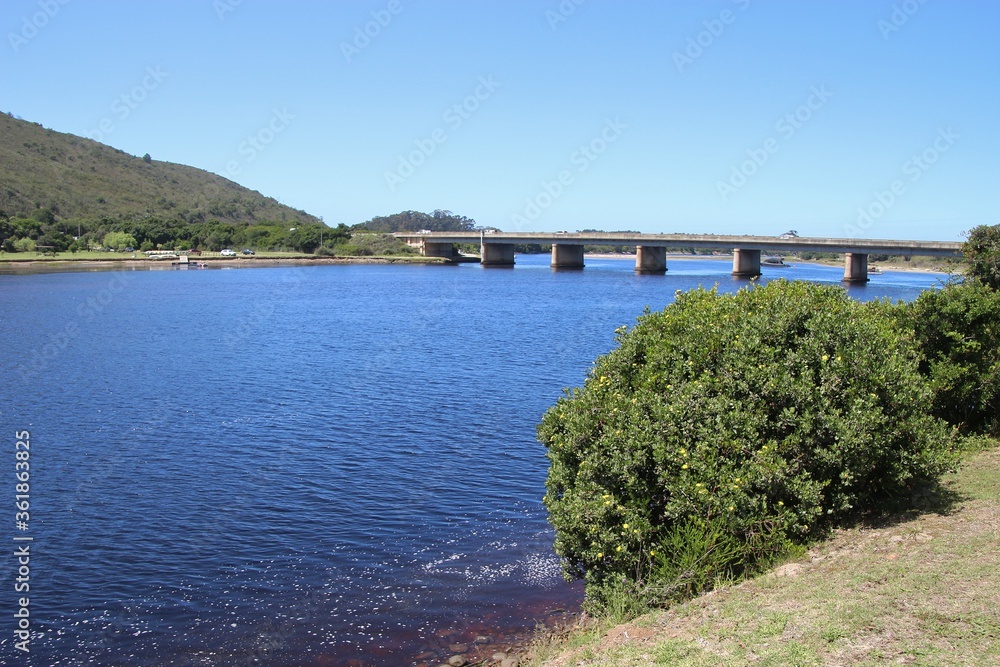 Estuary in Plettenberg Bay, a highway bridge in the background. Next to the coast and Indian Ocean. Garden Route, South Africa, Africa.