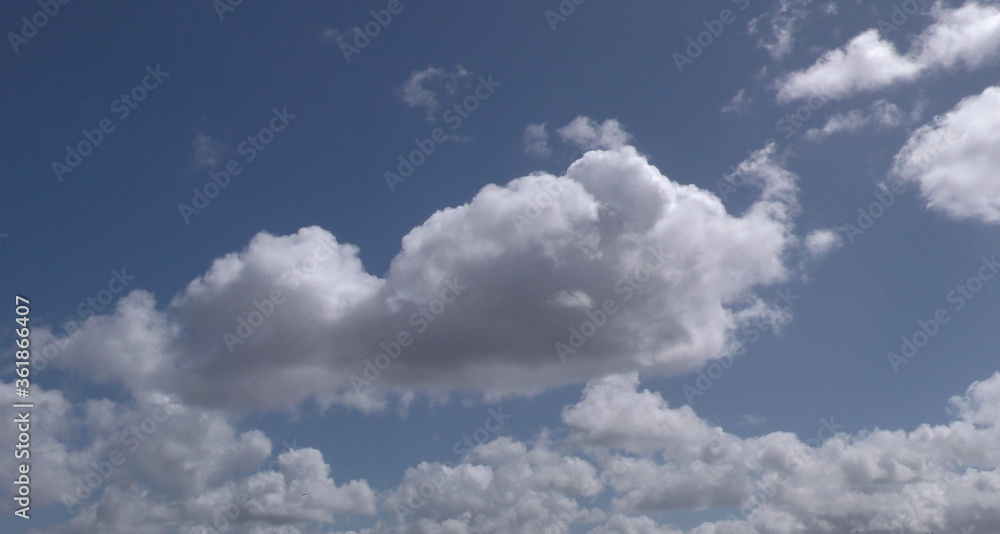 fluffy blue sky with clouds with main cloud 