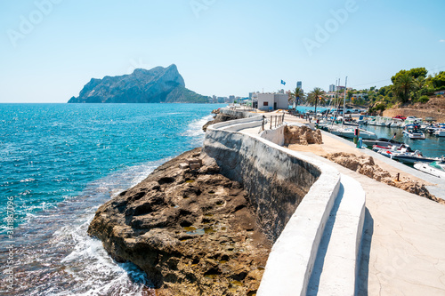 Bay of Les Bassetes with magnificent view of the Peñón de Ifach in Calpe, Costa Blanca, Spain