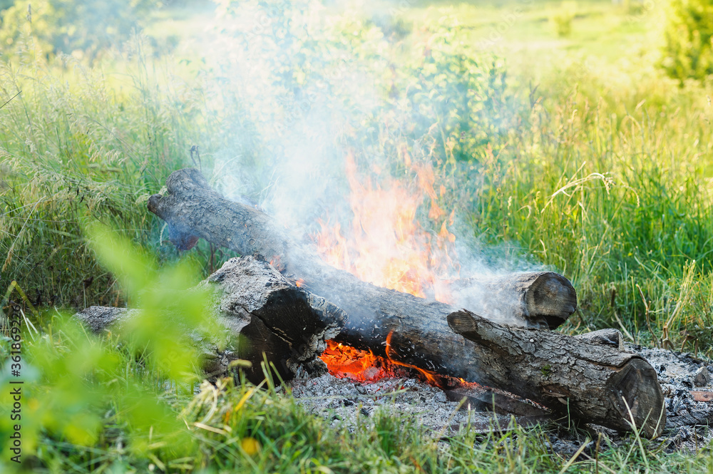 burning fire with smoke on nature background burning fire with smoke on nature background