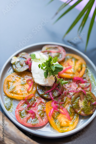 Heirloom Tomato and Cream Cheese Salad with Red Onion and Basil