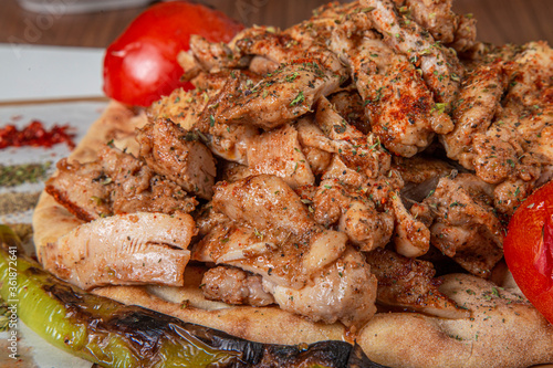 Turkish chicken meal on a wooden background.