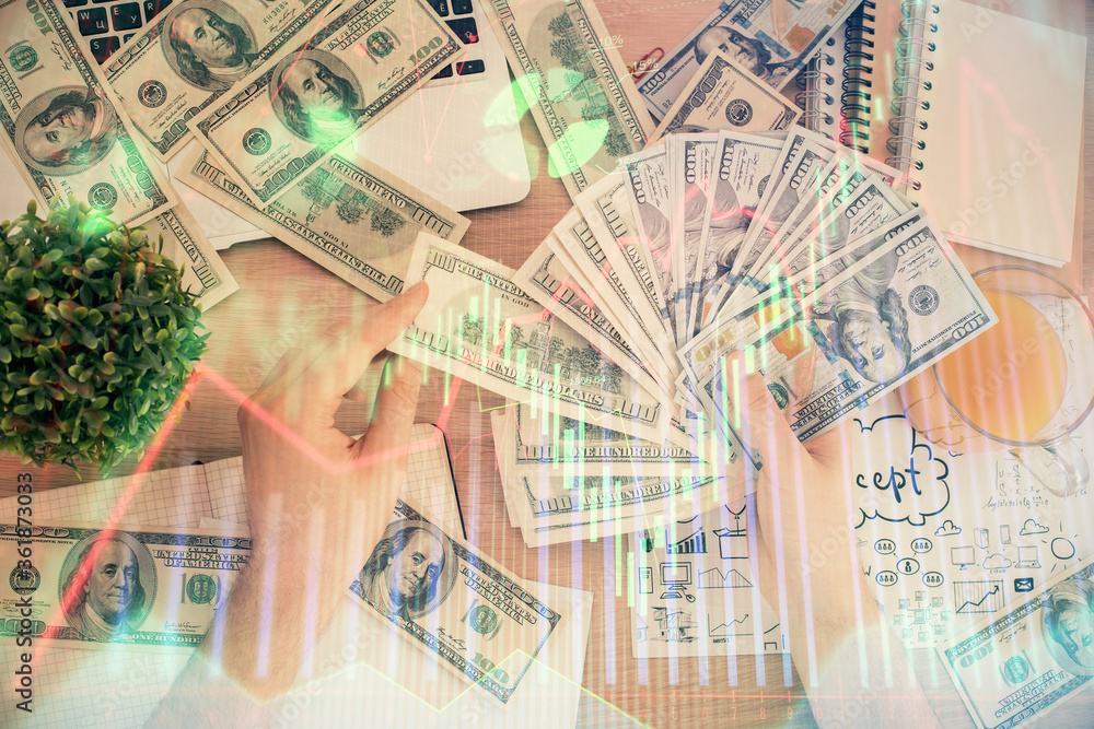 Multi exposure of financial graph drawing hologram and USA dollars bills and man hands. Analysis concept. Multi exposure of financial graph drawing hologram and USA dollars bills and man hands. Analysis concept.