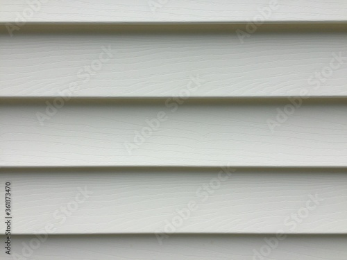 Slika na platnu Recently cleaned vinyl siding on a white house