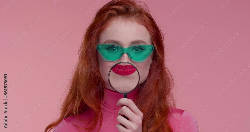 Beautiful female Model Using Dandruff and Chews Gum at same Moment, fashion Video shot. Wearing trendy clothes and having Modern Eyeglasses. Red haired woman standing in front of Camera. Beautiful female Model Using Dandruff and Chews Gum at same Moment, fashion Video shot. Wearing trendy clothes and having Modern Eyeglasses. Red haired woman standing in front of Camera.