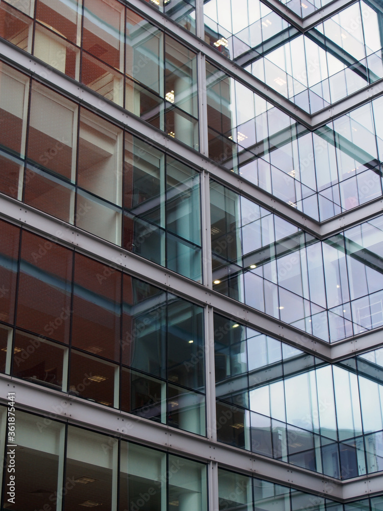 full frame modern office architecture angular abstract with geometric shapes and walls reflected in glass windows full frame modern office architecture angular abstract with geometric shapes and walls reflected in glass windows