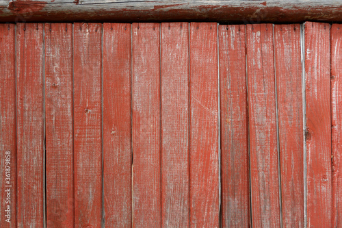 Background from red vertical old boards  part of the facade.