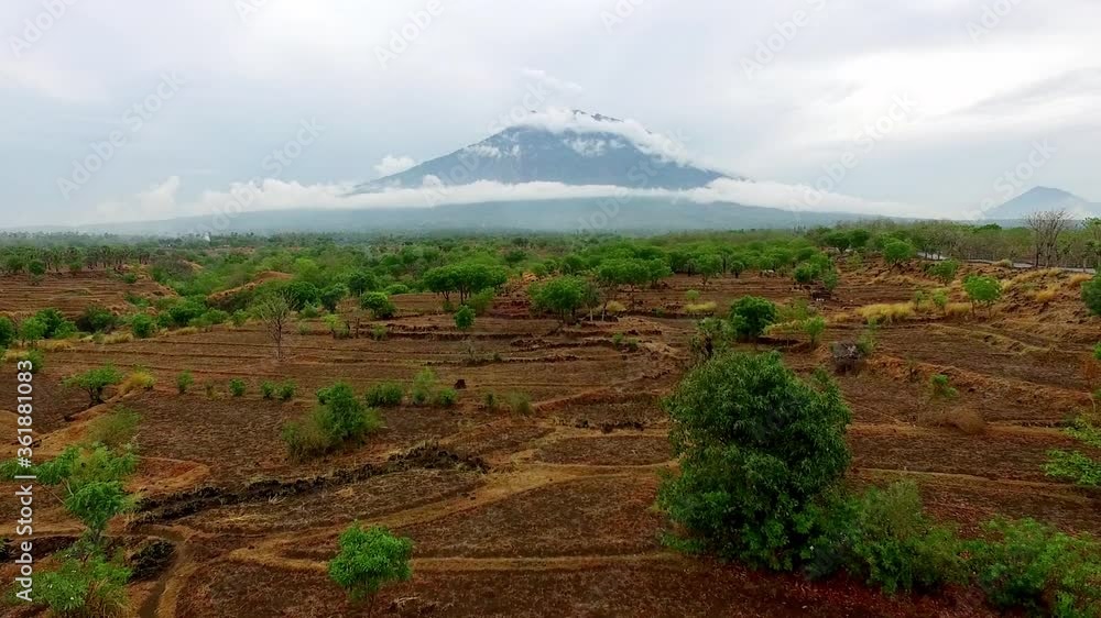 Beautiful aerial view over the dried fields of a tropical jungle near a volcano Beautiful aerial view over the dried fields of a tropical jungle near a volcano