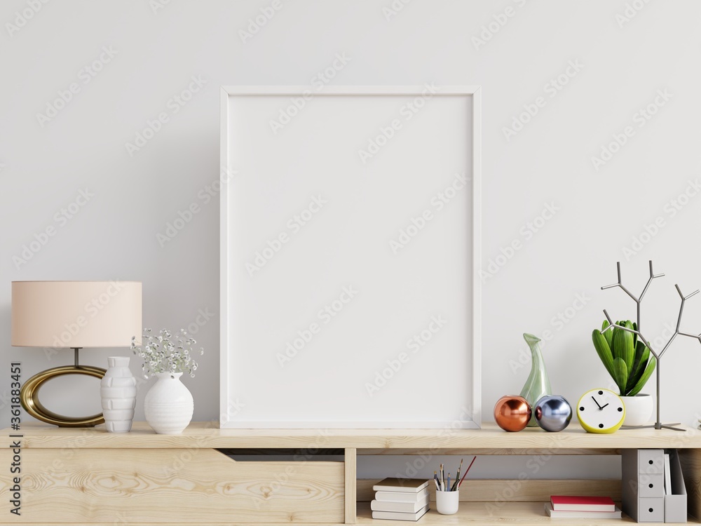 Poster mockup with vertical frame on table and white wall background. - obrazy, fototapety, plakaty 
