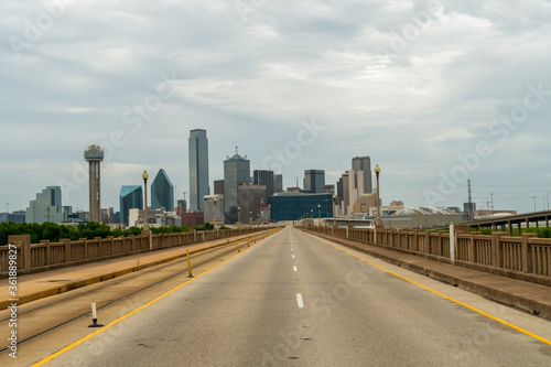 Dallas Skyline from Empty Highway With Dense Clouds on the Sky