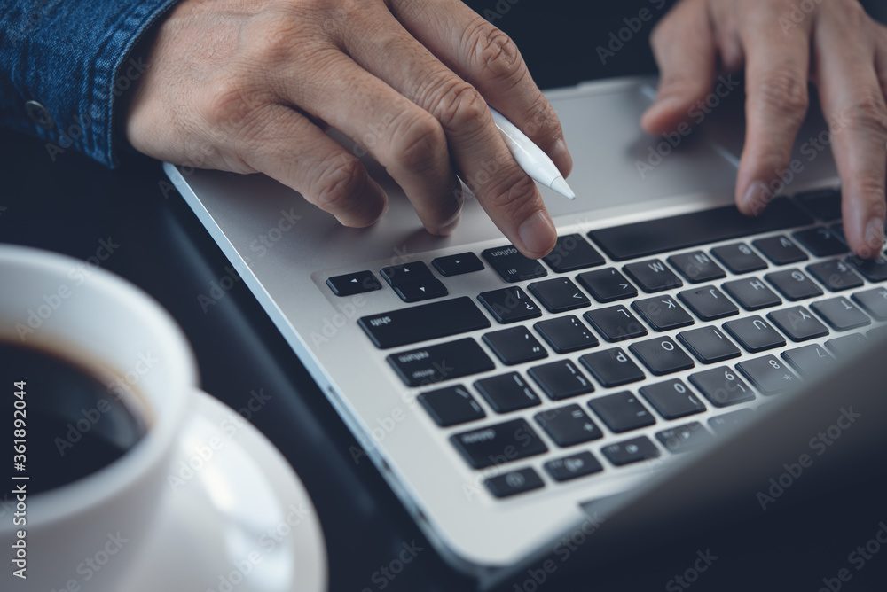close up of man hand typing on laptop computer keyboard close up of man hand typing on laptop computer keyboard