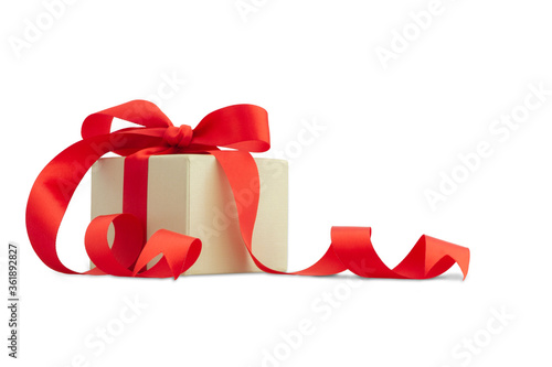 White gift box with red ribbon bow isolated on white background.