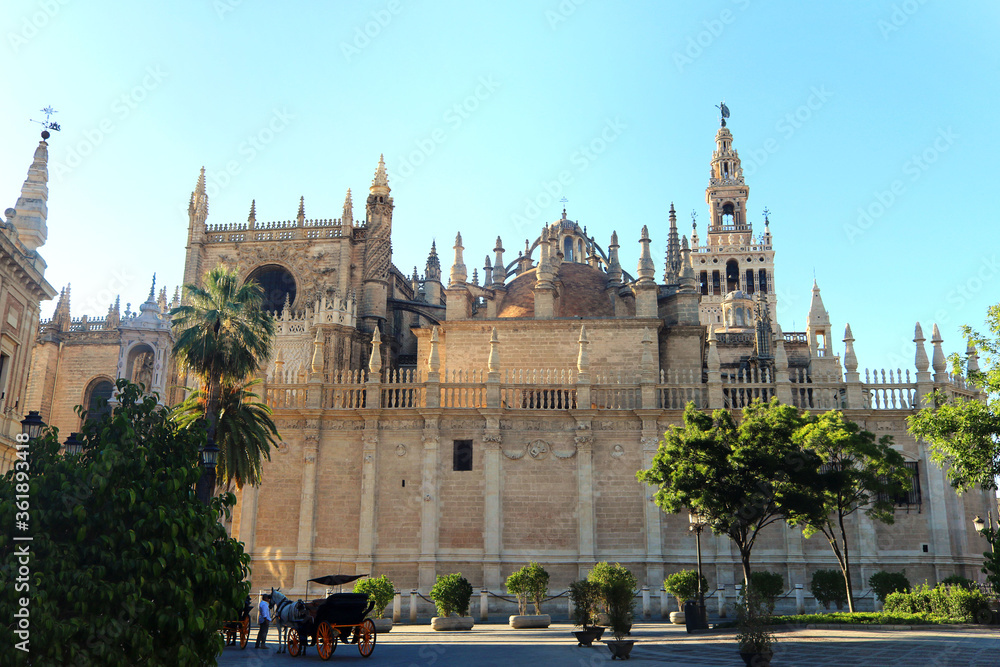 medieval gothic cathedral of Seville in Spain from behind, in a sunny day with a blue sky