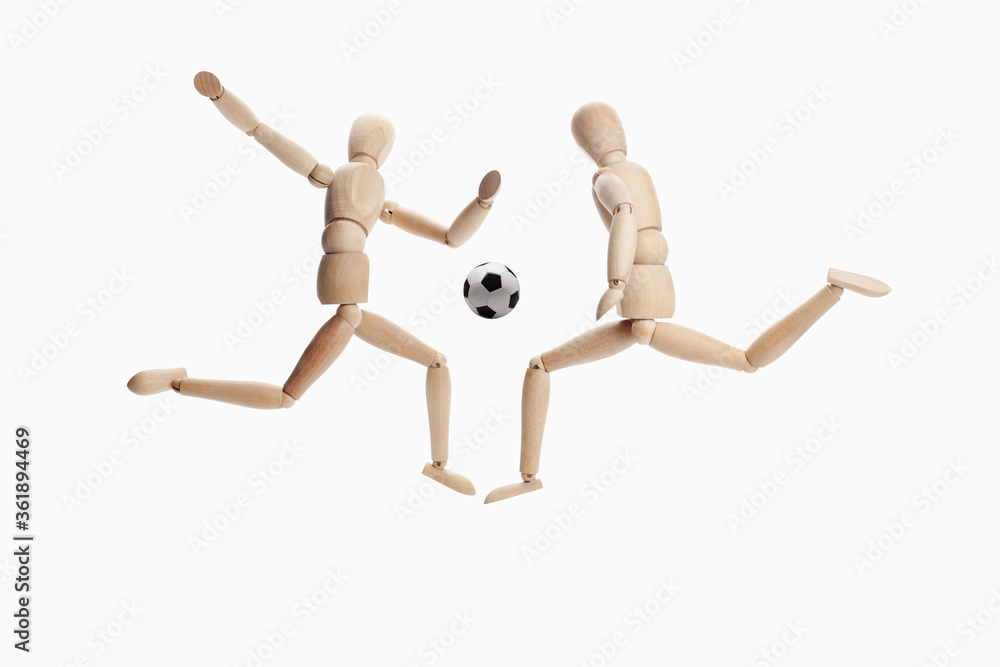 Wooden dummies models playing soccer Wooden dummies models playing soccer