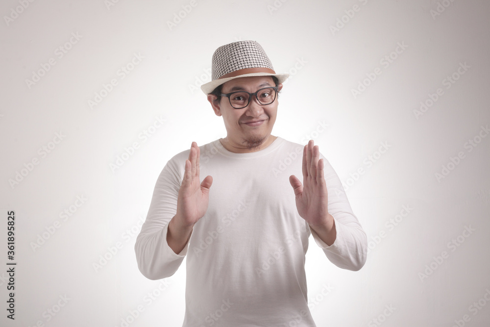 Happy Young Man Showing Something Between His Hands Happy Young Man Showing Something Between His Hands