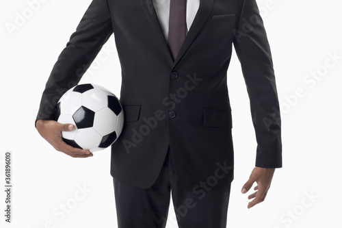 Fototapeta Naklejka Na Ścianę i Meble -  Soccer manager holding a ball