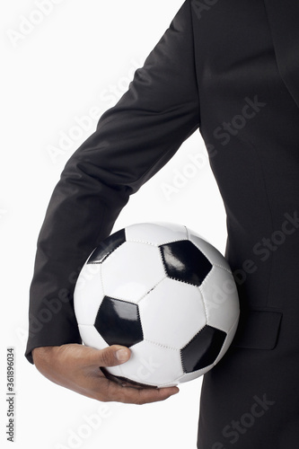 Soccer manager holding a ball © ImageHit