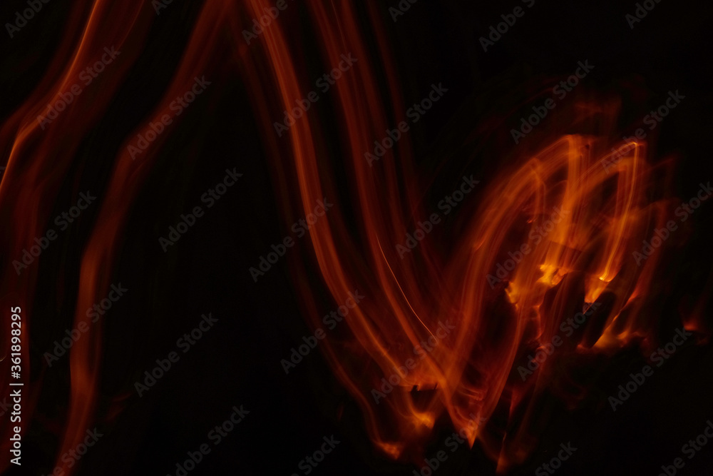 Fototapeta premium Light abstract, empty Charcoal grill with open fire light at night