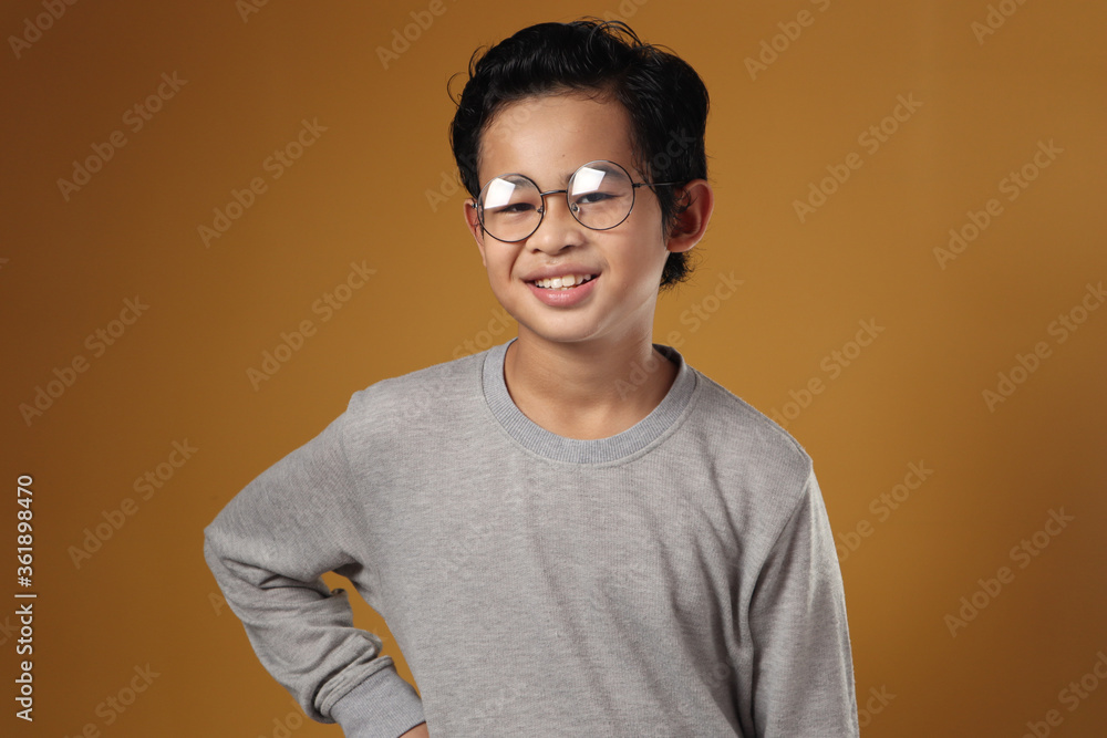 Smart Asian Boy Looking at Camera and Smiling Smart Asian Boy Looking at Camera and Smiling