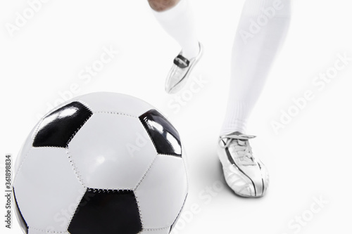 A soccer player ready to kick off