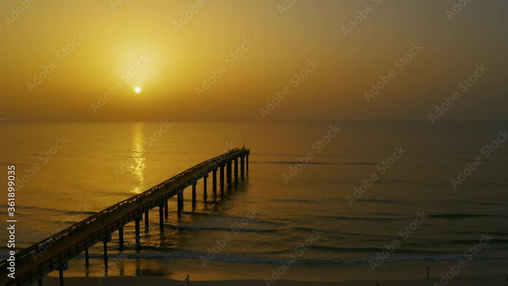 Saharan dust sunrise at the Saint Augustine Beach pier on Florida's east coast. Saharan dust sunrise at the Saint Augustine Beach pier on Florida's east coast.