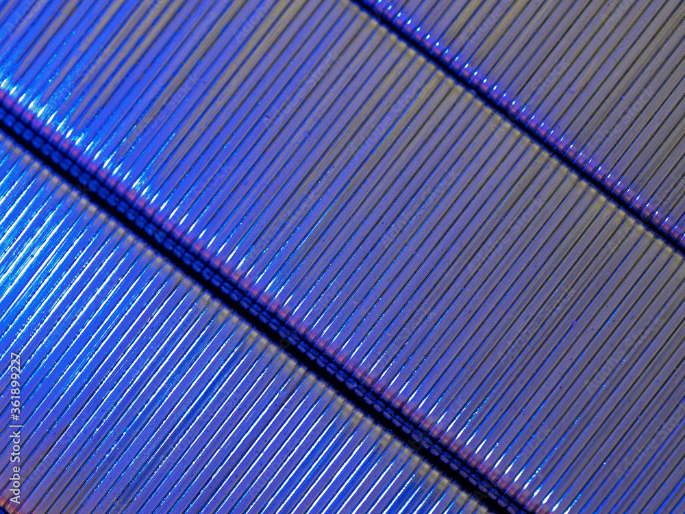 Obraz premium Cobalt blue and purple illuminated diagonally placed metal staples