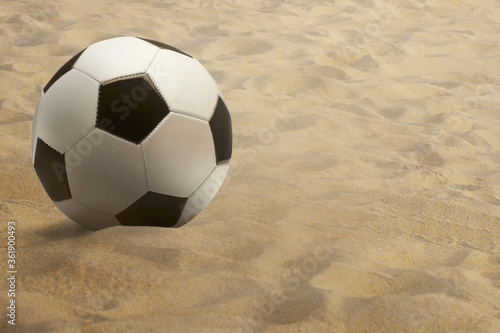 Soccer ball on sand