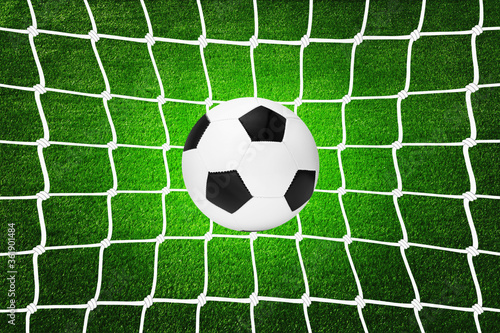A soccer ball in goal net