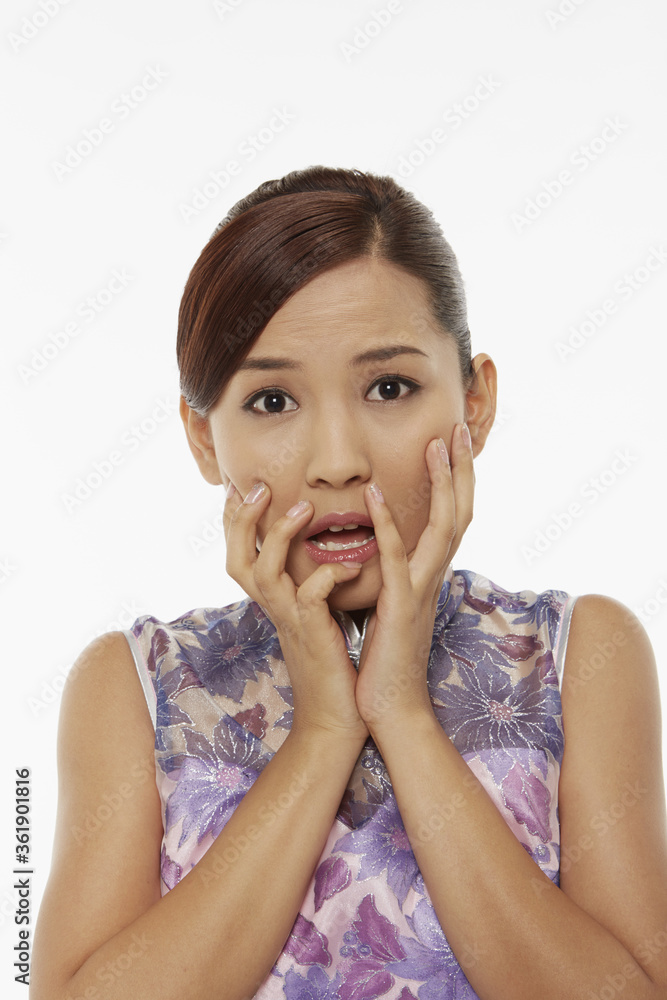 Woman in traditional clothing looking shocked Woman in traditional clothing looking shocked