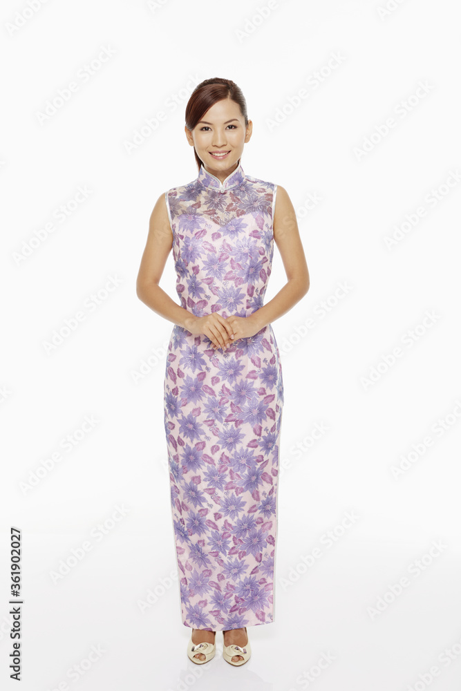 Woman in traditional clothing standing and smiling Woman in traditional clothing standing and smiling