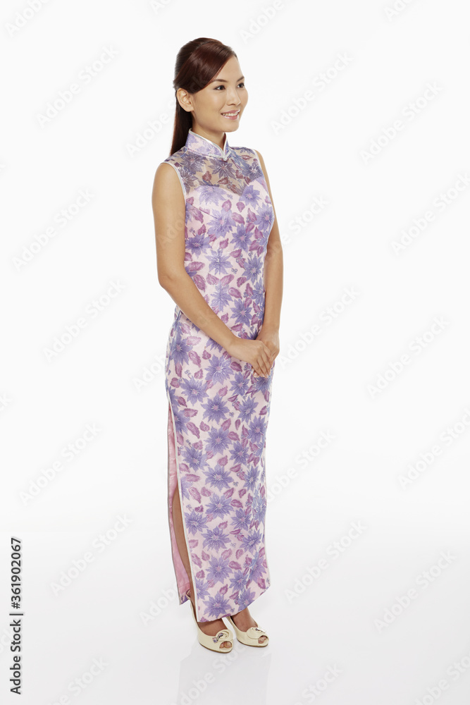 Woman in traditional clothing standing and smiling Woman in traditional clothing standing and smiling