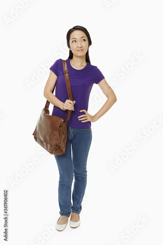 Woman carrying a brown sling bag