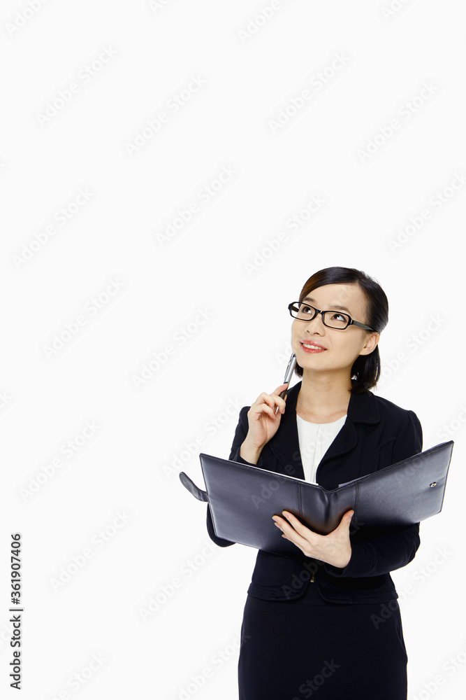 Cheerful businesswoman contemplating Cheerful businesswoman contemplating