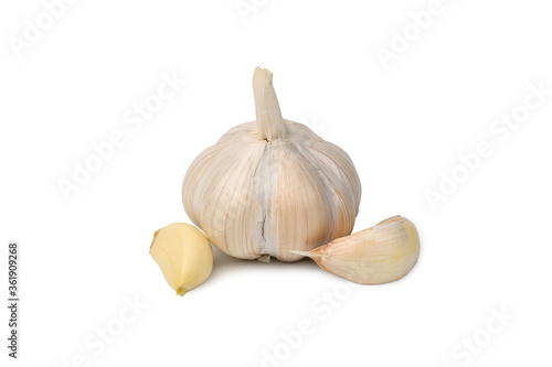 Raw garlic with segments isolated on white background